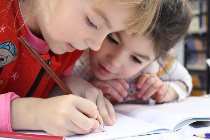 Childrens are drawing in notebook 