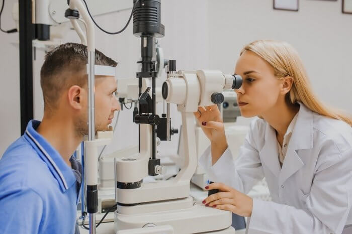 Optometrist checking an Adult eye in the clinic