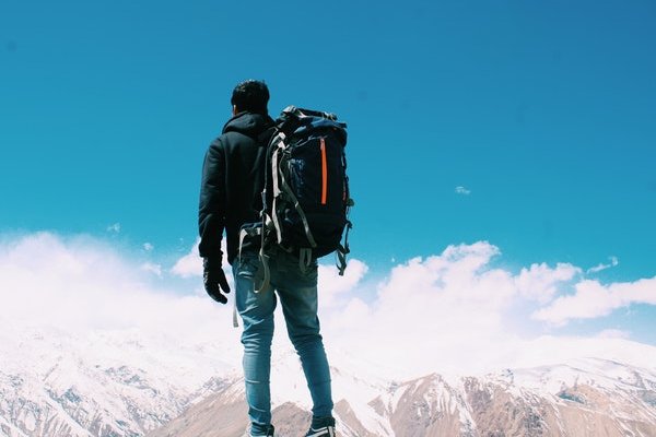 Man standing on top of the mountain