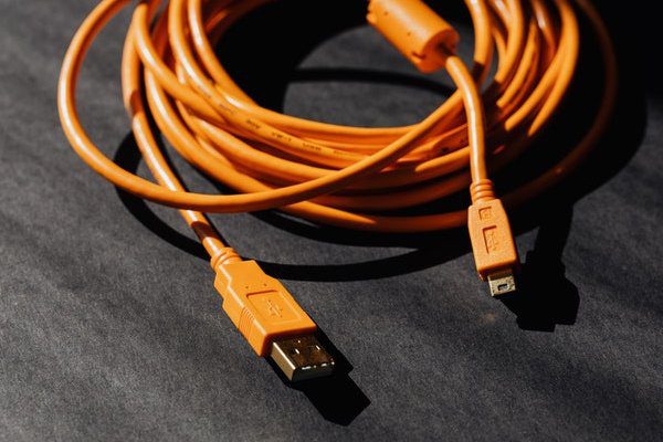 Organge USB cable on Black surface